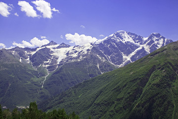 Glacier Seven and pastoral view on mountains in valley near Elbrus