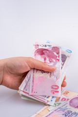 Hand holding Turksh Lira banknotes  in hand