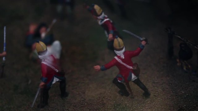 Close up of British toy figurines posed to battle