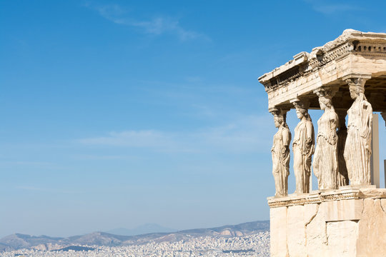 Female statues called caryatids in the Erechtheion at the sacred rock of the acropolis of Athens