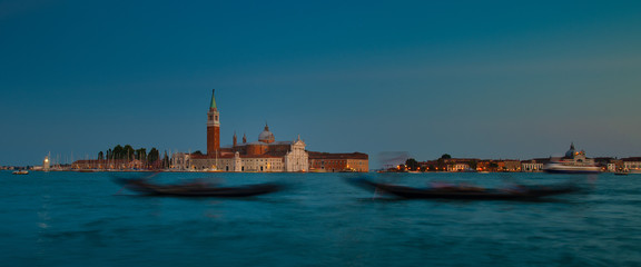Venice. Gondolas with a choppy effect on the lagoon with the island background of San Giorgio Maggiore