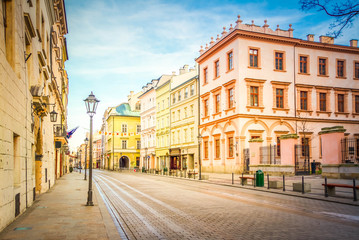 Fototapeta na wymiar street in old medieval town of Krakow, Poland, retro toned