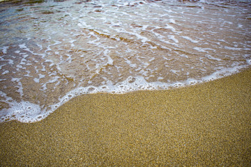 wave surf on the sandy beach