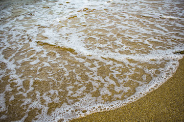 wave surf on the sandy beach