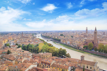 Beautiful view of the panorama of Verona and the Lamberti tower on the banks of the Adige River in Verona, Italy