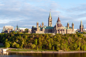 Fototapeta na wymiar Sunset on Parliament Hill - Ottawa, Ontario, Canada. Its Gothic revival suite of buildings is the home of the Parliament of Canada.