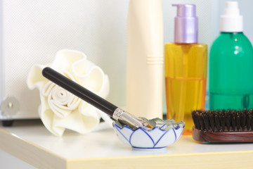 Toiletries in bathroom on shelf