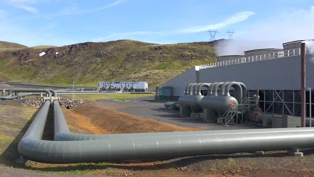 Establishing shot of a geothermal power plant in Iceland where clean electricity is generated.