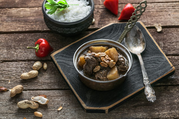 Thai Beef Massaman Curry with Rice, dark background copy space