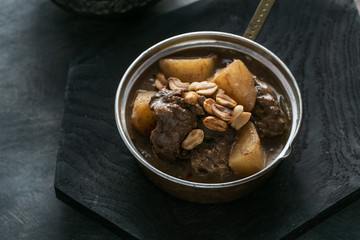 Close view of Massaman Curry with Rice, dark background copy space
