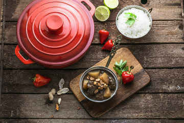Massaman beef curry on wood background.coconut milk curry.