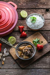 Thai massaman curry with beef and peanuts on the table