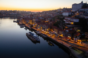Top view of Douro river and Ribeira at night, Porto, Portugal.
