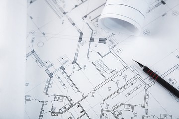 Blueprints with a drafting pencil on top of them