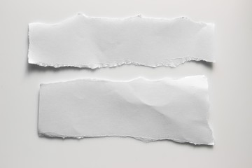 white torn paper on gray background. collection paper rip