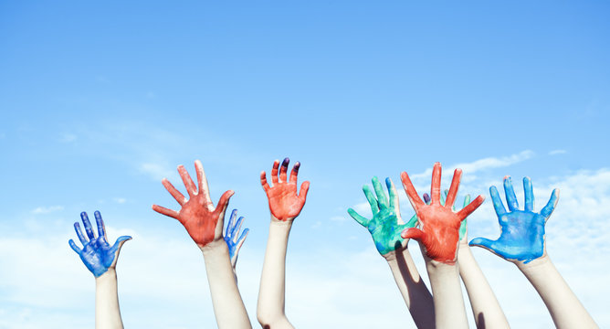 Happy children painted hands