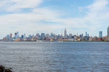 New York City NYC Manhattan Midtown Skyline and Empire State Building, viewed from Jersey City, New Jersey, USA
