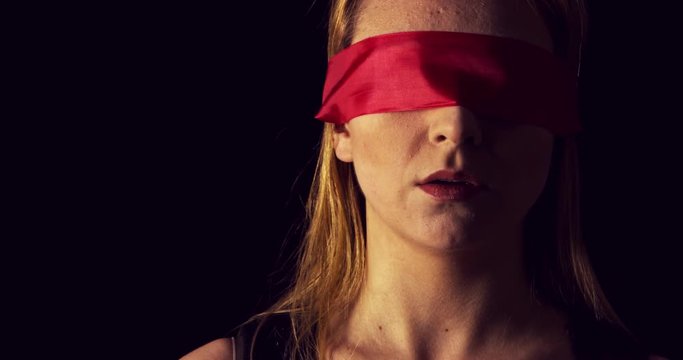 Portrait of the young woman blindfold