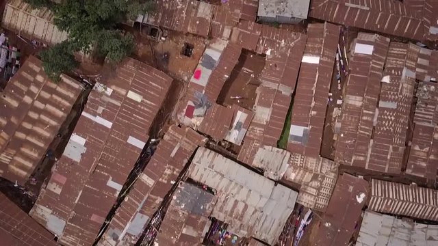 Remarkable aerial shot looking straight down above vast overpopulated slums in Kibera, Nairobi, Kenya, Africa.