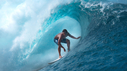 CLOSE UP: Crystal clear water splashes over surfer riding an epic barrel wave. - obrazy, fototapety, plakaty