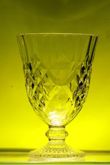 Transparency crystal glass on yellow background