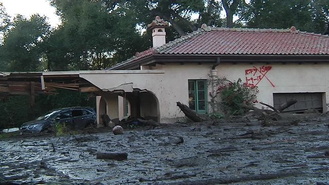 2018 - fire crews inspect damage from the mudslides in Montecito, California following the Thomas fire disaster.