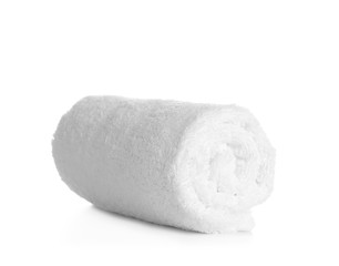 Fototapeta na wymiar Rolled clean soft towel on white background