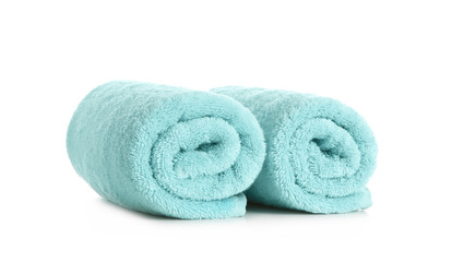 Fototapeta na wymiar Rolled clean soft towels on white background