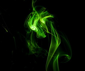 Green smoke on black background