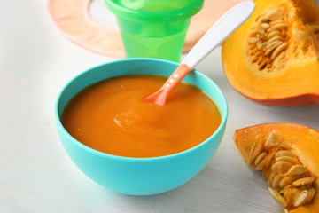 Bowl of healthy baby food on light table