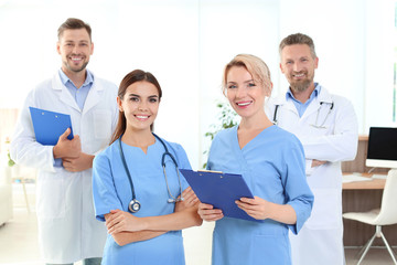 Doctors and medical assistants in clinic. Health care service
