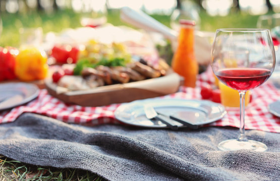 Blanket with food prepared for summer picnic outdoors