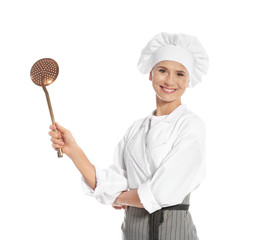 Naklejka premium Female chef holding skimmer on white background