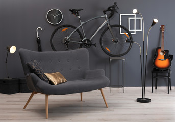 Stylish room interior with bicycle and sofa - obrazy, fototapety, plakaty