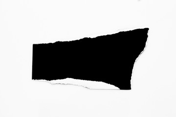 Black torn paper on gray background. collection paper rip
