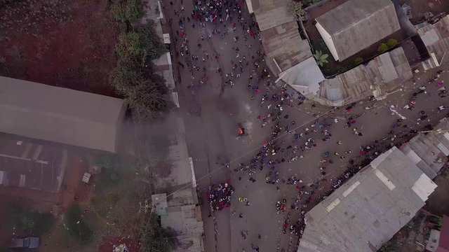 Aerial over rioting and riots in the Kibera slum of Nairobi during controversial elections in Kenya.