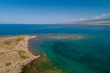 Lonely boat on a beach with aerial view.