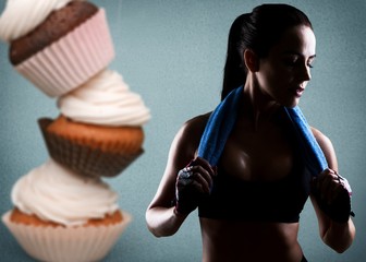 Fit young woman fighting off fast food