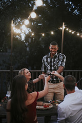 Friends toasting with red wine