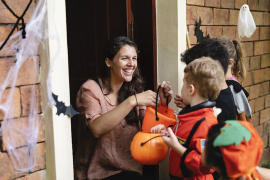Little children trick or treating on Halloween