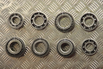 Car parts - New bearings on the background of corrugated aluminum sheet