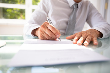 Businessman Filling Contract Form