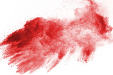 Freeze motion of red powder exploding, isolated on white background. Abstract design of red dust cloud. Particles explosion screen saver, wallpaper