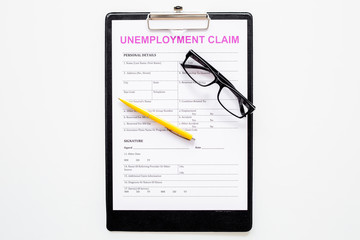 Unemployment claim form on white background top view