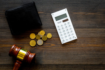 Bankruptcy concept. Judge gavel, wallet, coins, calculator on dark wooden background top view copy...