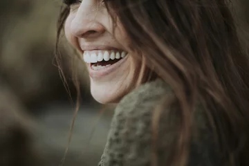 Foto op Aluminium Close up of a woman smiling © Rawpixel.com