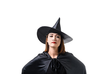 Portrait of woman in black Scary witch halloween costume standing with hat isolated on white background