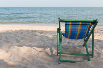empty wooden beach chair at the beach