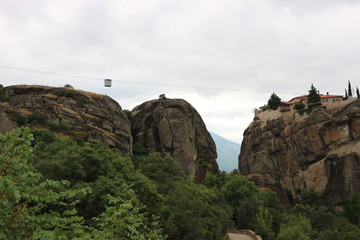 Fototapeta premium Transportation in cable car to monastery of Holy Trinity, Meteora, Thessaly, Greece