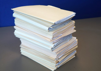 close up on the stacking documents and folders